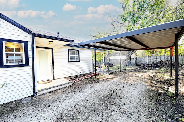 exterior space with a carport