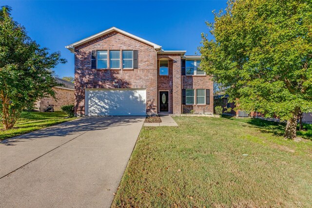 view of front of property featuring a garage and a front yard