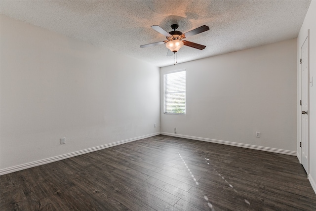 empty room with a textured ceiling, dark hardwood / wood-style floors, and ceiling fan