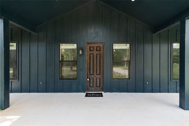 doorway to property featuring covered porch