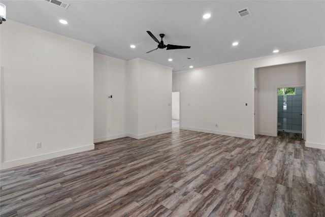 empty room with hardwood / wood-style floors and ceiling fan