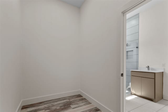 bathroom with vanity and hardwood / wood-style flooring