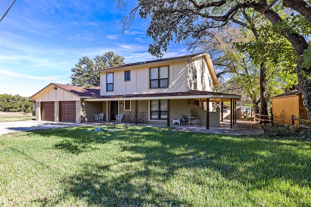 view of front of home featuring a garage and a front yard