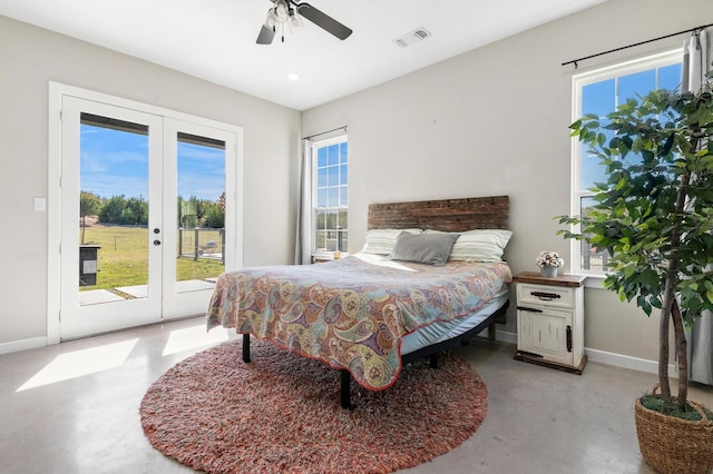 bedroom with access to outside, multiple windows, french doors, and ceiling fan