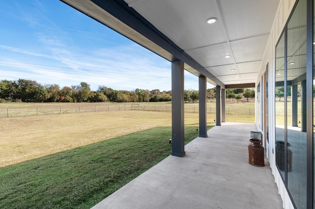 view of yard with a rural view