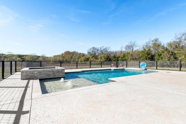 view of pool with pool water feature, an in ground hot tub, and a patio area