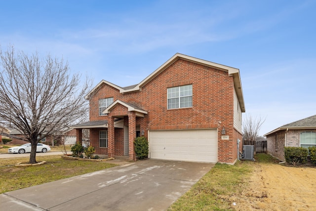 view of front of house featuring central AC unit, a garage, and a front lawn