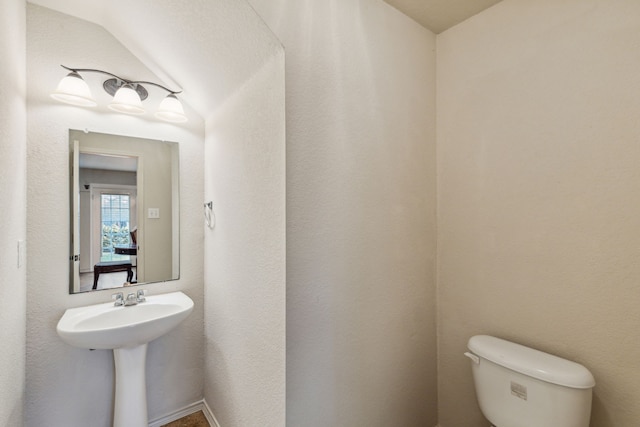 bathroom with sink and toilet