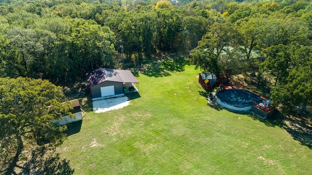 aerial view featuring a wooded view