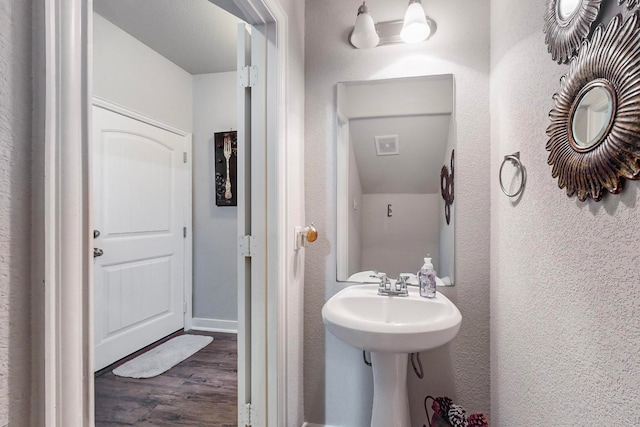 bathroom with hardwood / wood-style flooring