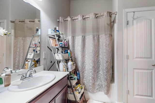 bathroom featuring vanity and shower / bath combo with shower curtain