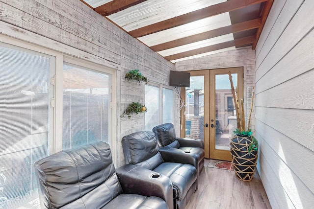 sunroom featuring french doors and lofted ceiling with beams