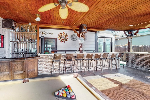 view of patio / terrace with ceiling fan and an outdoor bar