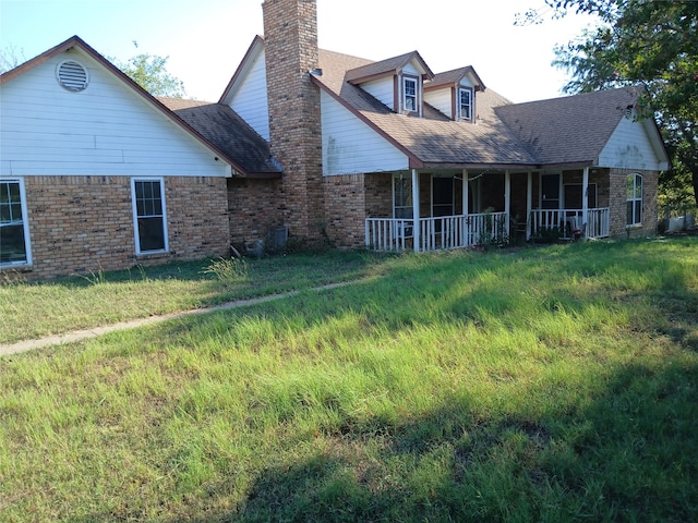 back of house with covered porch and central air condition unit