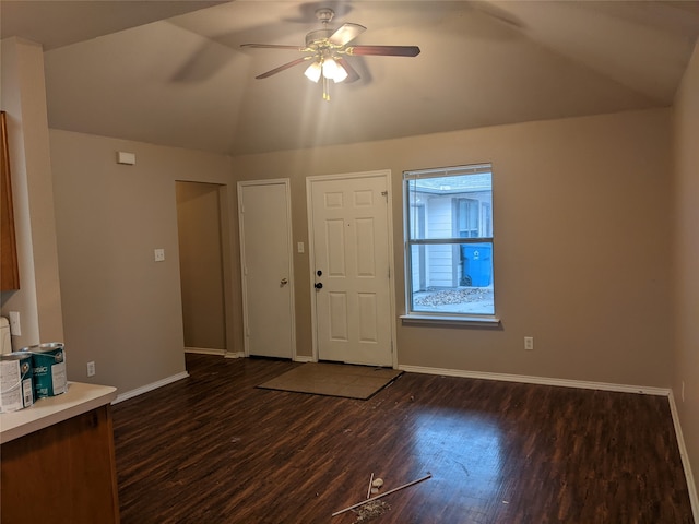 entryway featuring dark hardwood / wood-style flooring, vaulted ceiling, and ceiling fan