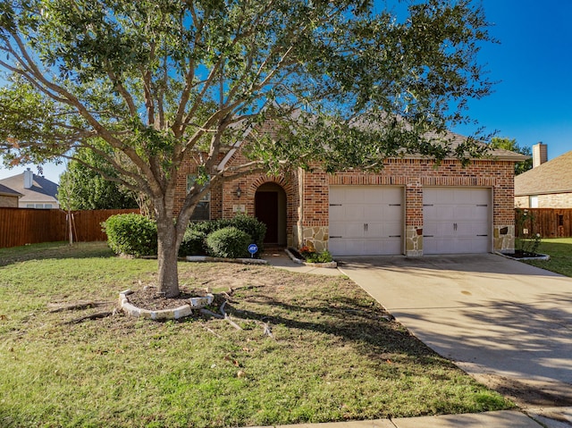 view of front of home featuring a garage and a front lawn