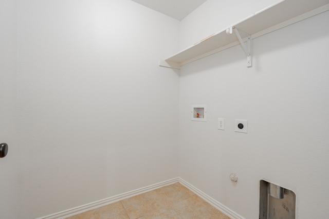 clothes washing area featuring hookup for a washing machine, light tile patterned floors, gas dryer hookup, and electric dryer hookup