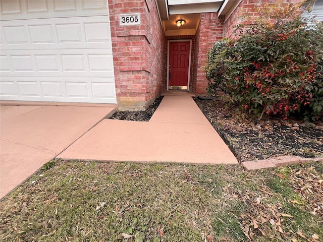 doorway to property featuring a garage