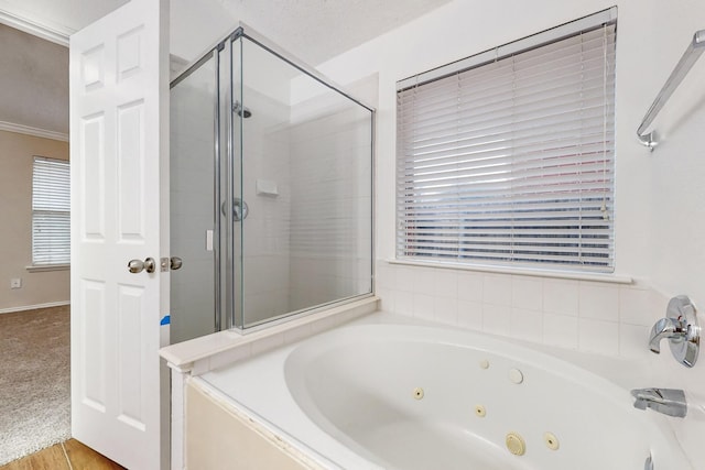 bathroom featuring independent shower and bath, crown molding, and hardwood / wood-style flooring