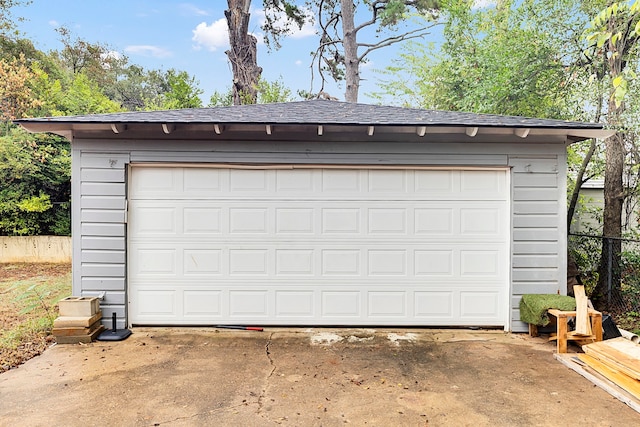 view of pool with a garage and an outdoor structure