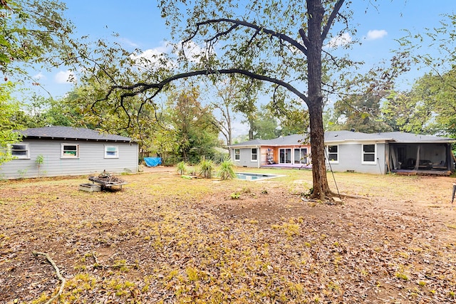 view of yard with a sunroom