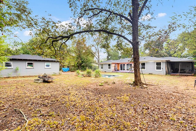 view of yard with a sunroom