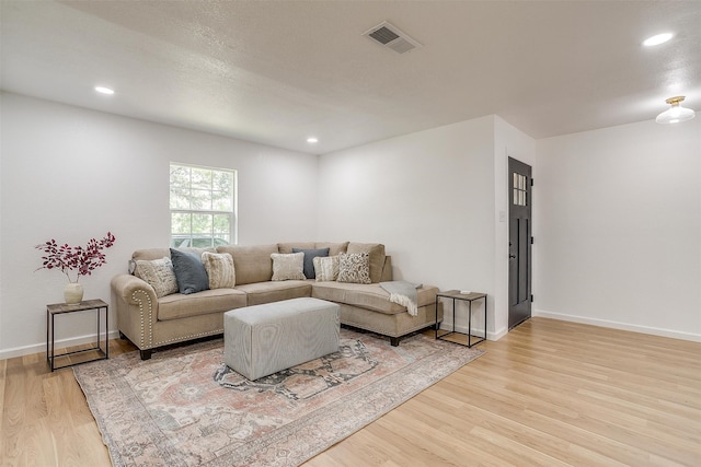 living room with light hardwood / wood-style floors