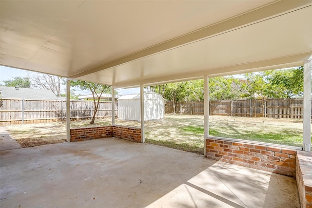 view of patio / terrace featuring a storage unit