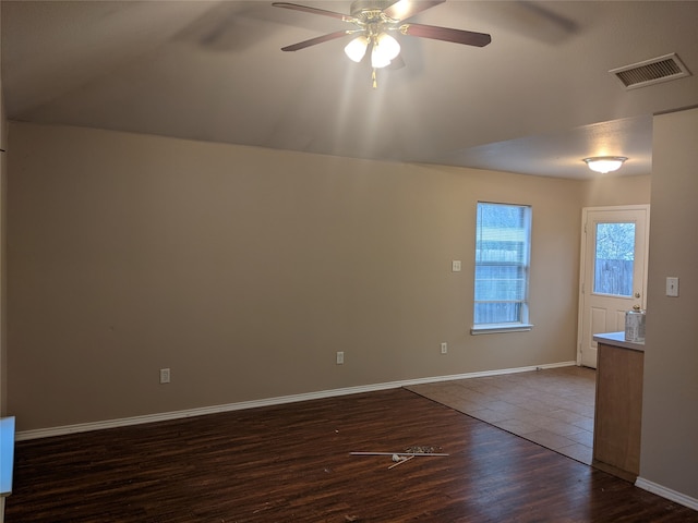 unfurnished room with dark hardwood / wood-style floors and ceiling fan