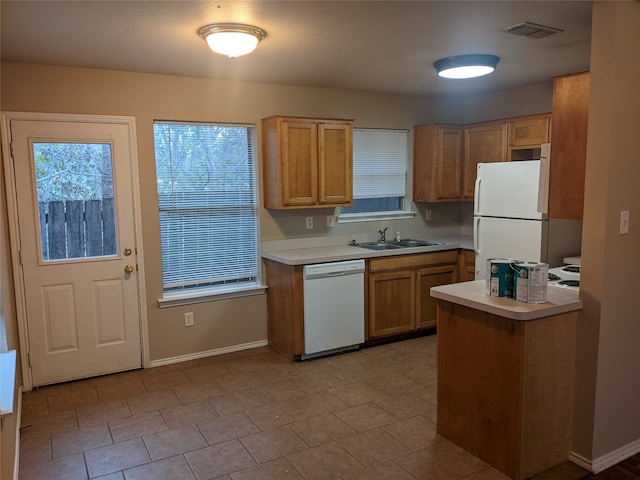 kitchen with sink and white appliances