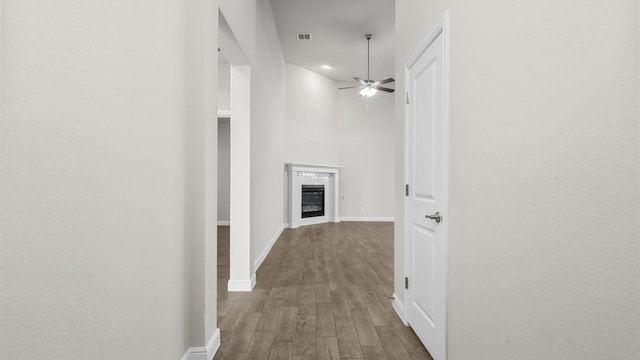 hallway with hardwood / wood-style floors