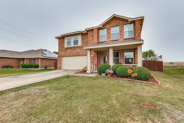 view of front of home featuring a garage and a front lawn