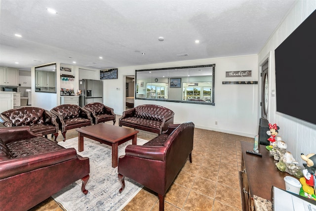 tiled living room with a textured ceiling