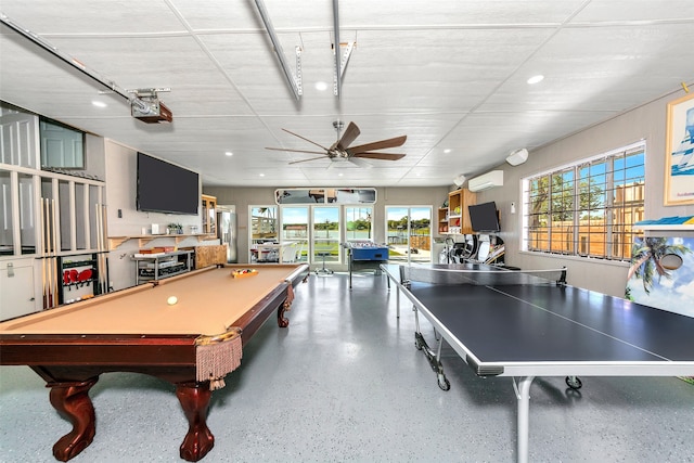 playroom with ceiling fan, an AC wall unit, and billiards