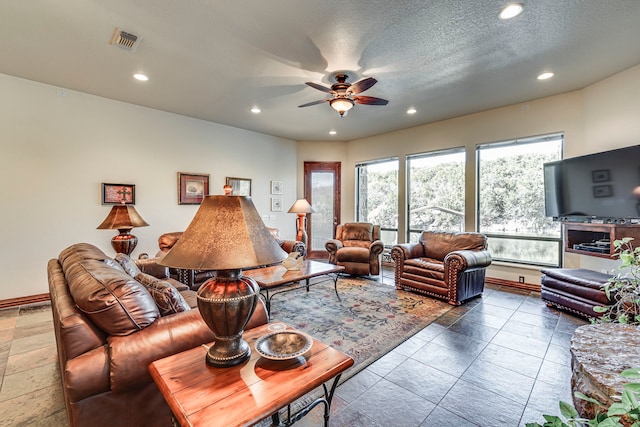 1133 Brackeen Dr, Graford, TX 76449 - living room with a ceiling fan, recessed lighting, and baseboards