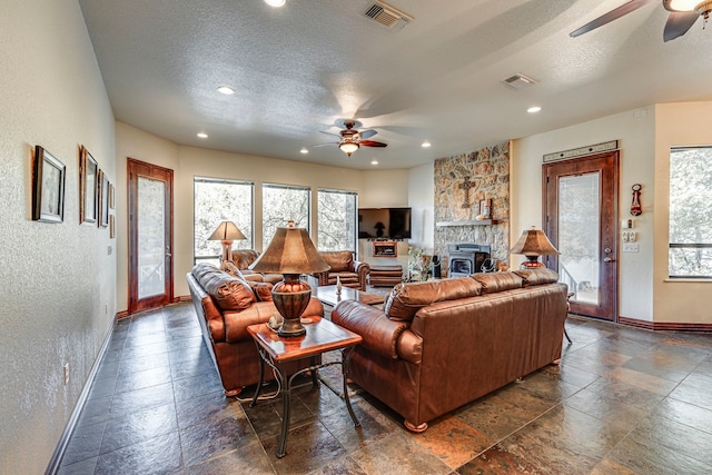 1133 Brackeen Dr, Graford, TX 76449 - living room featuring ceiling fan, baseboards, plenty of natural light, a textured ceiling, and recessed lighting