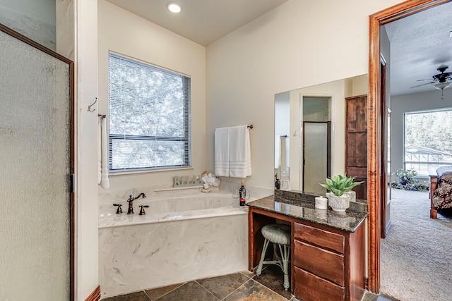 1133 Brackeen Dr, Graford, TX 76449 - bathroom featuring a garden tub, an enclosed shower, vanity, and a ceiling fan