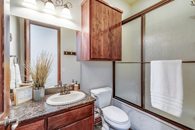 1133 Brackeen Dr, Graford, TX 76449 - full bath featuring vanity, toilet, and enclosed tub / shower combo
