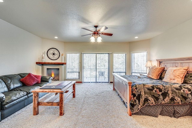 1133 Brackeen Dr, Graford, TX 76449 - bedroom with carpet flooring, recessed lighting, multiple windows, a textured ceiling, and access to exterior