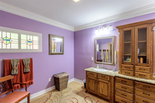 bathroom with vanity and crown molding