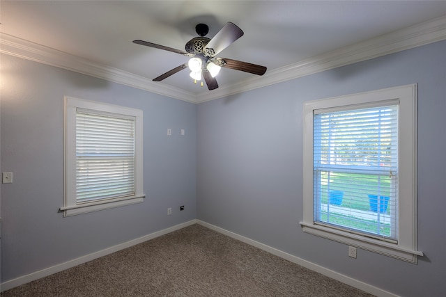 empty room featuring ornamental molding, carpet flooring, and ceiling fan