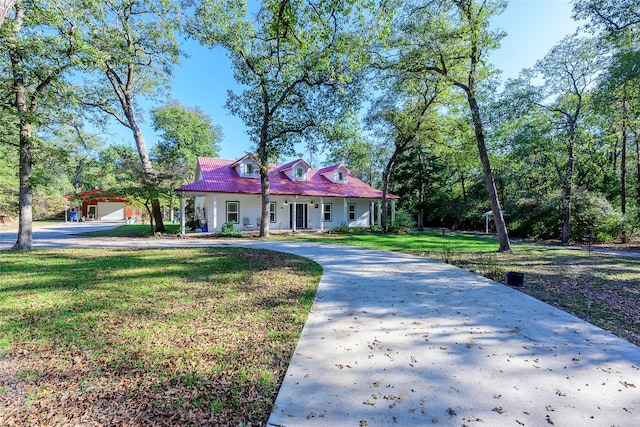 view of front of property with a garage and a front lawn