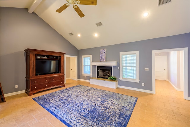 living room with ceiling fan, beam ceiling, and high vaulted ceiling