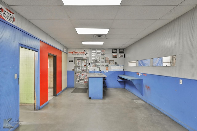 basement with a drop ceiling