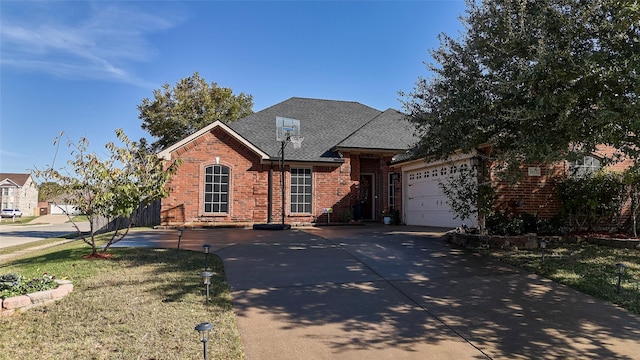 view of front of property featuring a garage and a front lawn