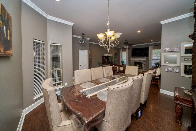 dining room with ceiling fan with notable chandelier, ornamental molding, and dark wood-type flooring