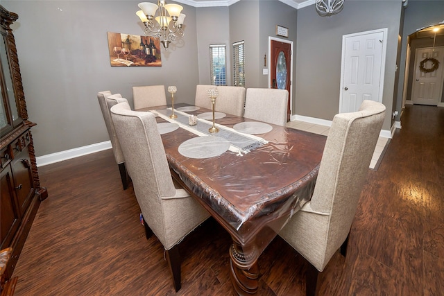 dining area with hardwood / wood-style floors, ornamental molding, and a chandelier