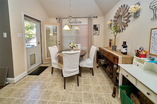 dining room with light tile patterned floors, an inviting chandelier, and lofted ceiling