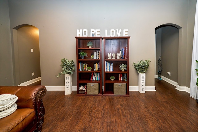 living area with dark hardwood / wood-style floors