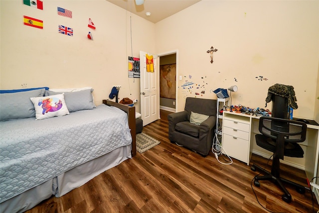 bedroom with dark wood-type flooring